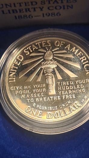 American 1986s silver dollar. Ellis Island