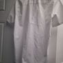 Mans white shirt... Image 7