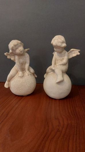 Lovely Vintage Pair of Ceramic Baby Winged Angels Sitting on Globes with a Very Tactile Cream Coloured Crackle Glaze