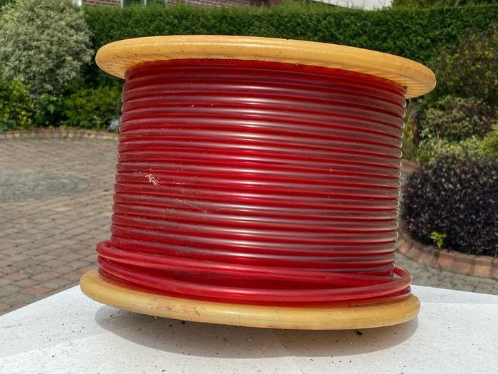Reel of plastic tubing