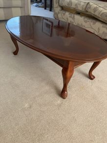 Oval teak coffee table - highly polished finish