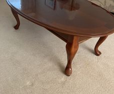 Oval teak coffee table - highly polished finish