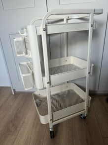 Useful storage trolley on wheels with pegboard