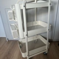 Useful storage trolley on wheels with pegboard