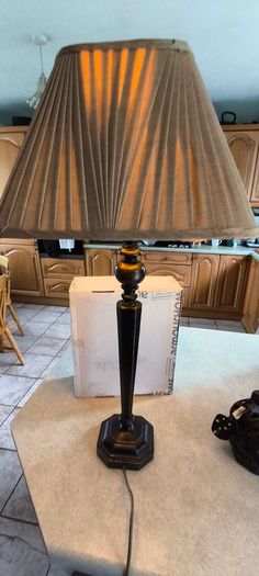 Vintage ebonized table lamp featuring an octagonal base, likely dating from the early 20th century.