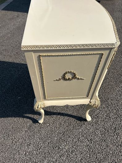 Vintage Olympus cream and gilt Louis style chest of drawers featuring bow-front drawers and cabriole legs.