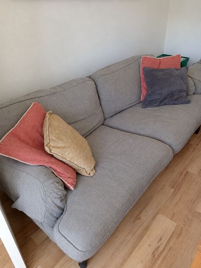 Two-seater grey fabric sofa