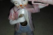 old porcelain figurine of clown.