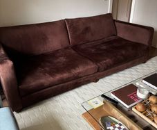 Brown velvet sofa with bun feet