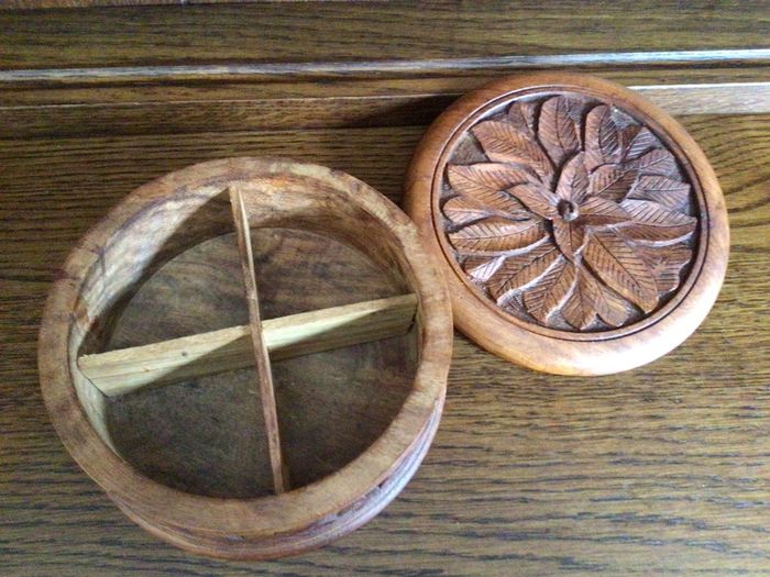 Wooden circular box with carved leaf pattern