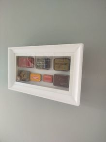 framed tobacco tins