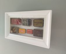 framed tobacco tins