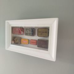 framed tobacco tins