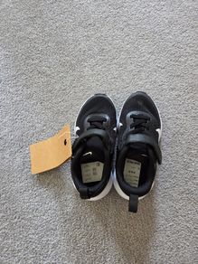 Kids size 7.5 UK Nike revolution 7 black and white trainers