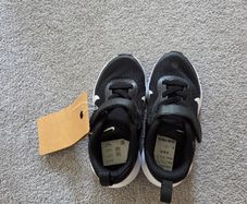 Kids size 7.5 UK Nike revolution 7 black and white trainers