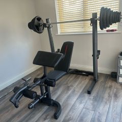 Home Gym Equipment: Adjustable Weider Gym Bench, Olympic bars, and Rubber Weights