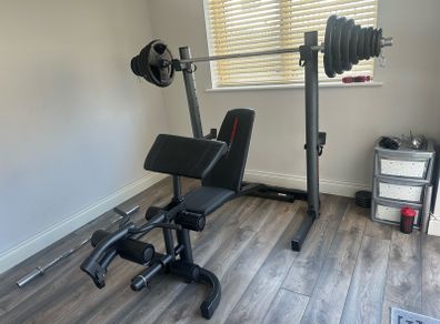 Home Gym Equipment: Adjustable Weider Gym Bench, Olympic bars, and Rubber Weights