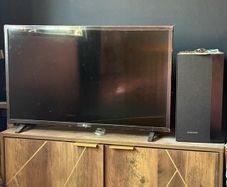 LG TV with Samsung soundbar and speaker
