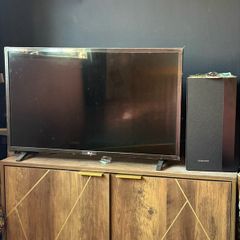 LG TV with Samsung soundbar and speaker