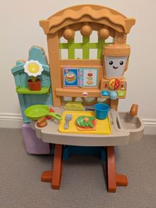 Fisher-Price Laugh & Learn Grow-the-Fun Garden to Kitchen