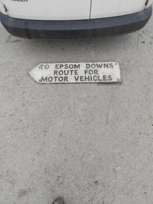 old aluminum road sign