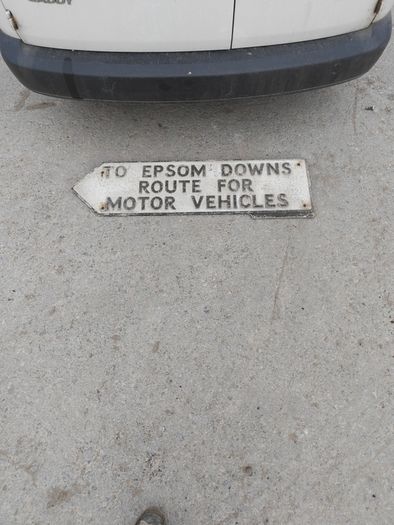 old aluminum road sign