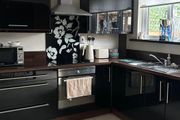 Black high gloss kitchen units and countertop