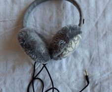 On-ear earmuffs with built-in headphones (corded)