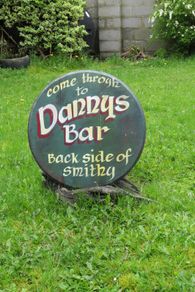 Dannys Bar, Old Irish Pub advertisement sign made on Oak barrel lid
