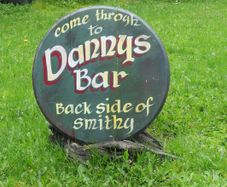 Dannys Bar, Old Irish Pub advertisement sign made on Oak barrel lid