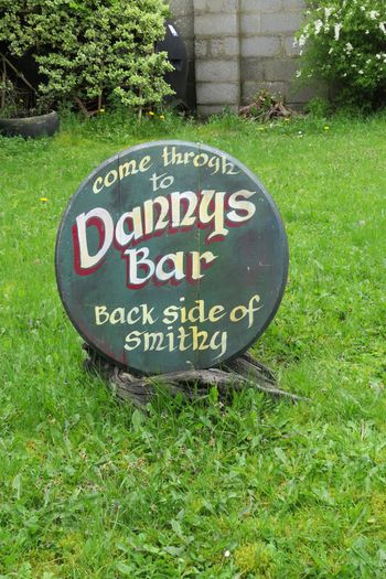 Dannys Bar, Old Irish Pub advertisement sign made on Oak barrel lid