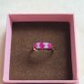 Beautiful yellow gold ring featuring three stunning rubies surrounded by sparkling cubic zirconia stones. Size M, in beautiful condition. Image 3