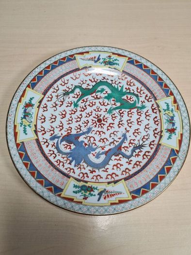 Vintage chinese porcelain plate with dragons decoration hand painted