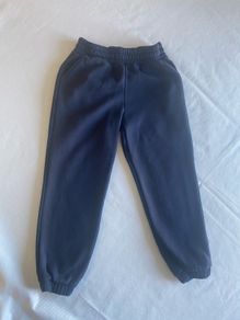 Dunnes navy tracksuit bottoms (age 6-7)