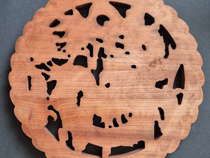 Carved decorative wooden plaque, featuring dragons.