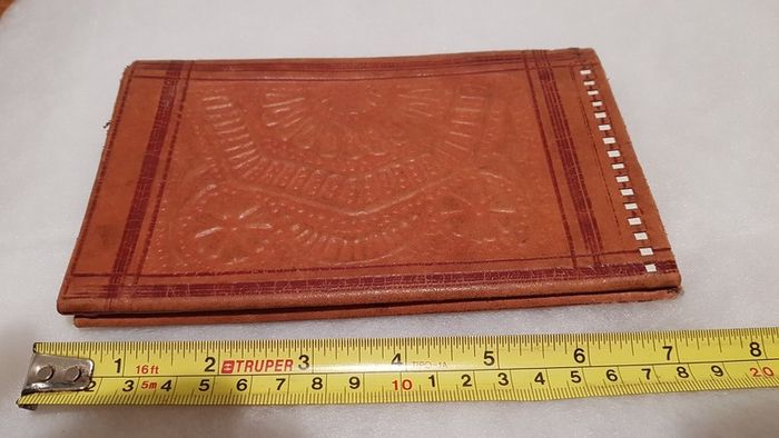 handcrafted made soft leather wallet,with designs ,, thank you,,was used,some wear and tear,,take as is ..