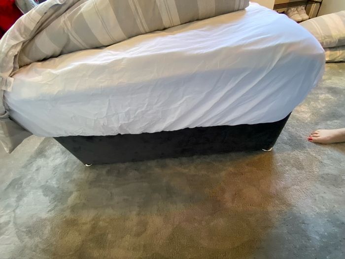 Grey double bed and mattress