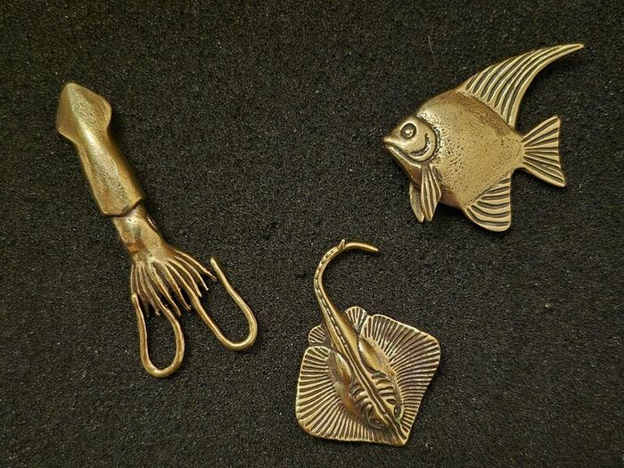 3 brass fish.