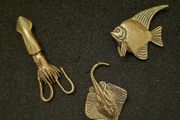 3 brass fish.