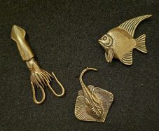 3 brass fish.