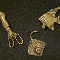 3 brass fish.