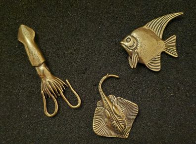 3 brass fish.