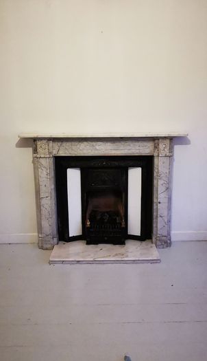 Regency Carrera Marble Bullseye Fireplace