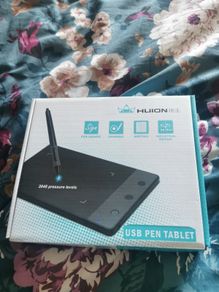 Huion graphics tablet with USB pen