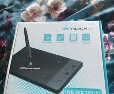 Huion graphics tablet with USB pen