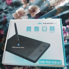 Huion graphics tablet with USB pen