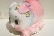 A vintage ceramic piggy bank with its original rubber bung (late 1960's)