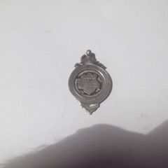 a solid silver medal on it c,m,w  fcc