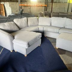 Large grey corner sofa with 2 footstools