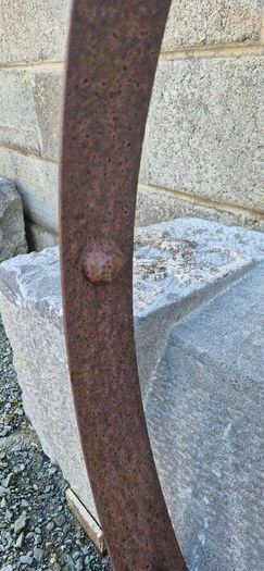 old wrought iron wheel.